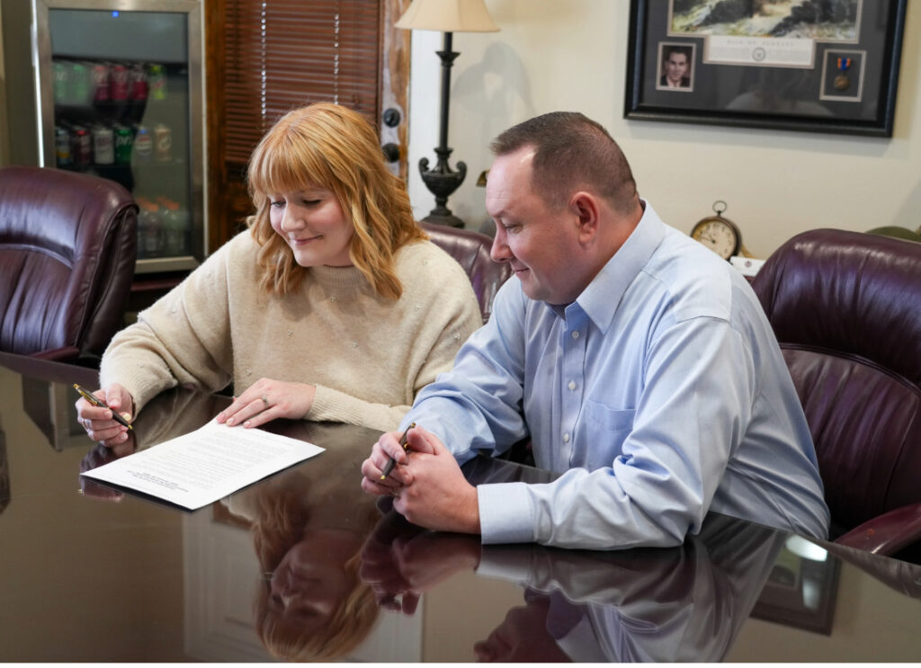 Married couple in their 40s review estate planning documents