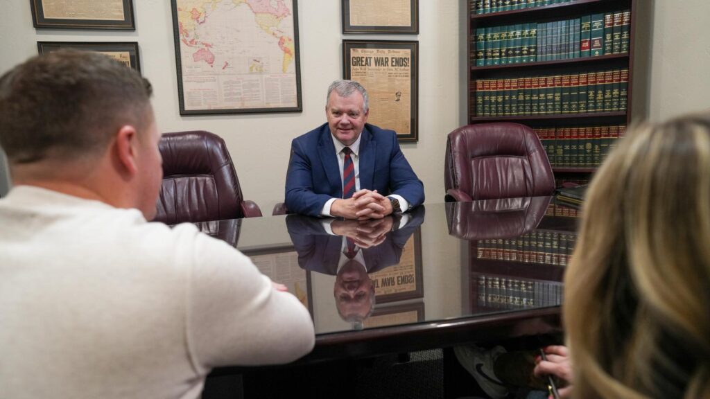 Utah attorney gives couple advice in office setting.